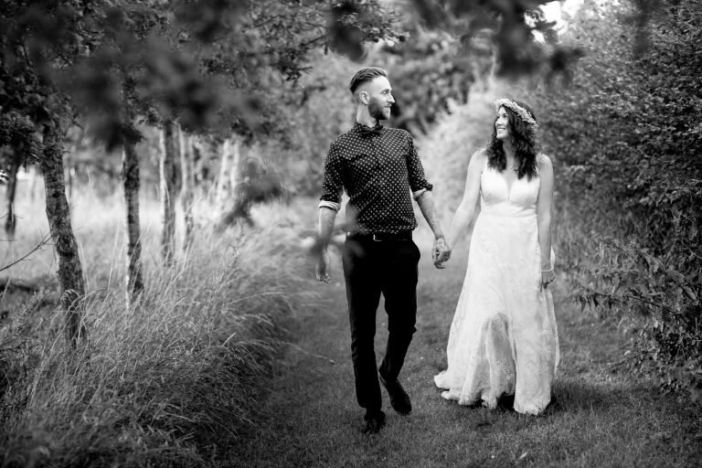 Couple take a walk together at Gloucester wedding