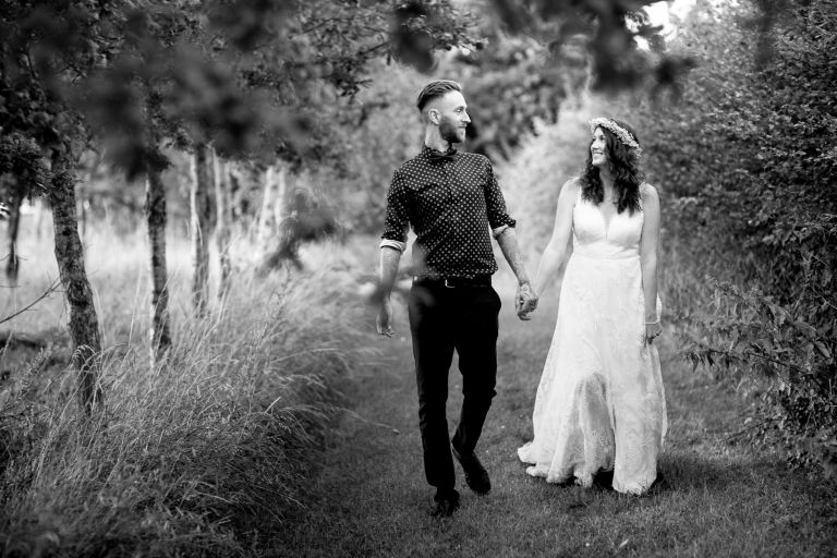 Couple take a walk together at Gloucester wedding