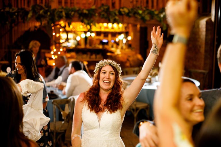 Bride celebrates dancing at The Over Barn
