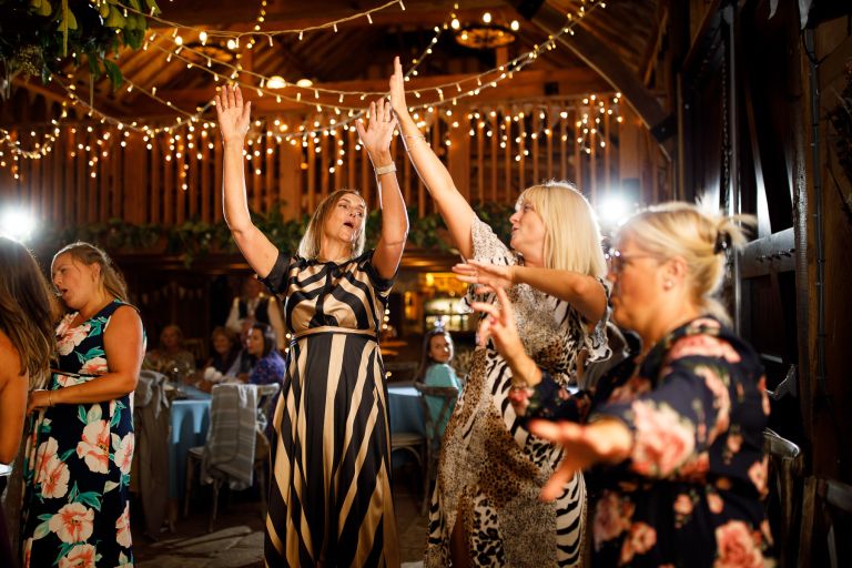 Guests dance inside Gloucester Barn wedding