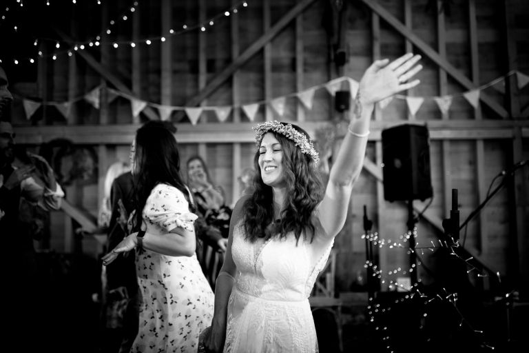 Bride sings with arm in the air to Mister Kanish