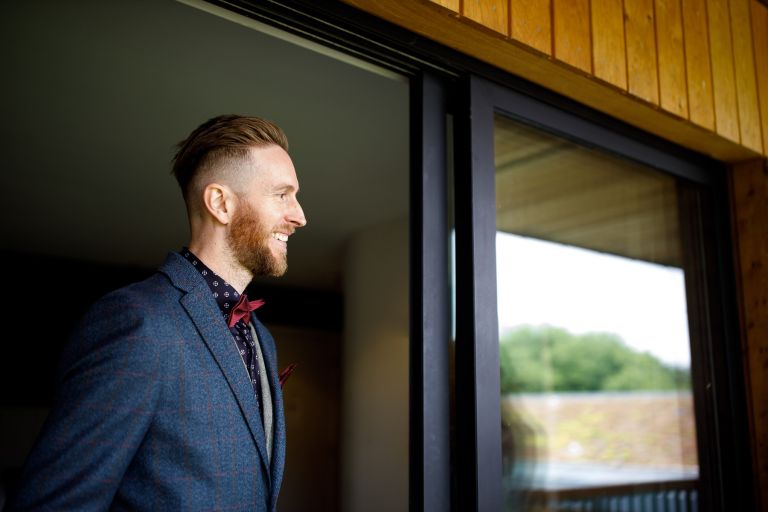 Groom sees his bride in her dress for the first time