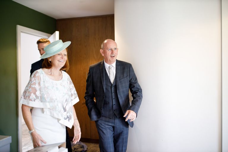 Brides parents see her for the first time in her dress 