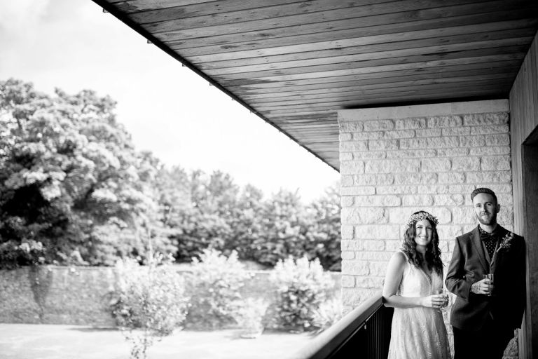 Couple have a drink before they head off for their ceremony at The Over Barn