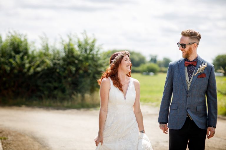 The Over Barn wedding photo walking in the grounds