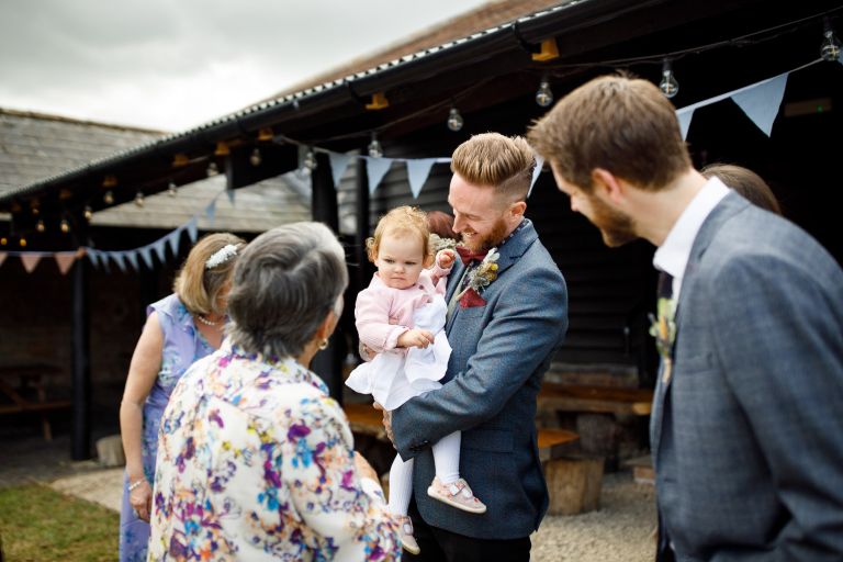 The Over Barn wedding candid with baby