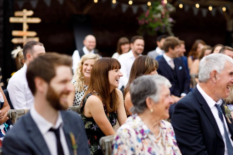 Guests laugh during the humanist wedding ceremony in Gloucester