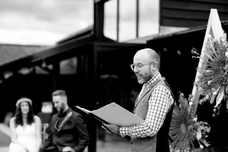 MAD Ceremonies conducting the humanist wedding ceremony outside at The Over Barn