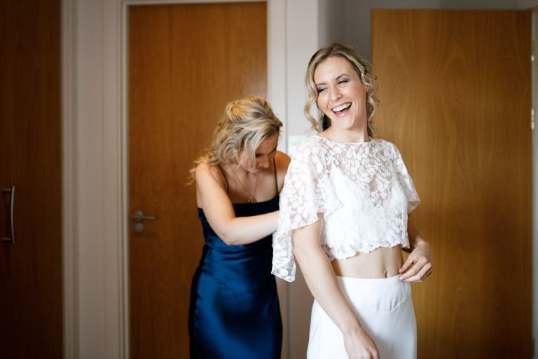 Bride gets ready with sister at SACO apartments Bristol