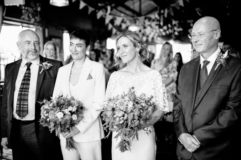 Brides with their Dads at beginning of wedding ceremony at same sex wedding Bristol