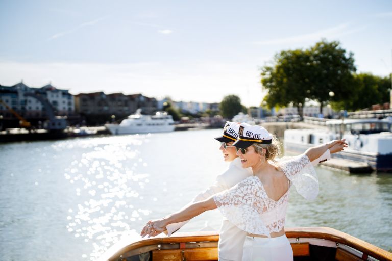 Brides pose titanic on their wedding day boat tour on the Tower Belle Bristol Packet